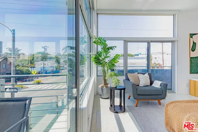 a living room with furniture and stairs