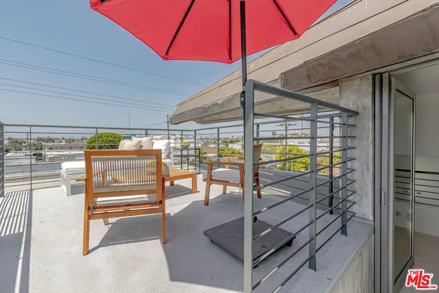 a hallway with a view of living room