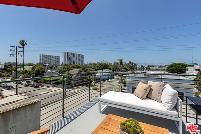 a living room with furniture a lamp and a table