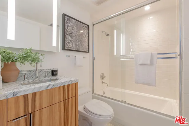 a view of a house with wooden fence