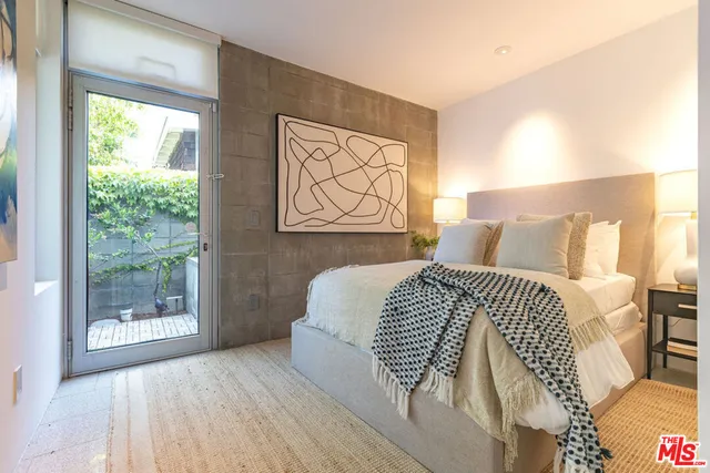 an aerial view of a house with a swimming pool