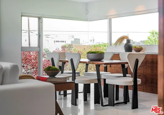 a kitchen with a potted plant on the counter and a potted plant