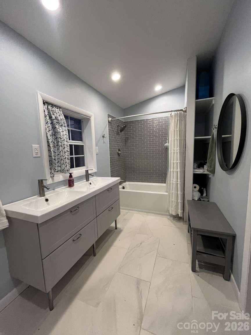 3445 Irish Hills Road Morganton, NC 28655 - Photo 22 of 34 a bathroom with a sink double vanity and a mirror