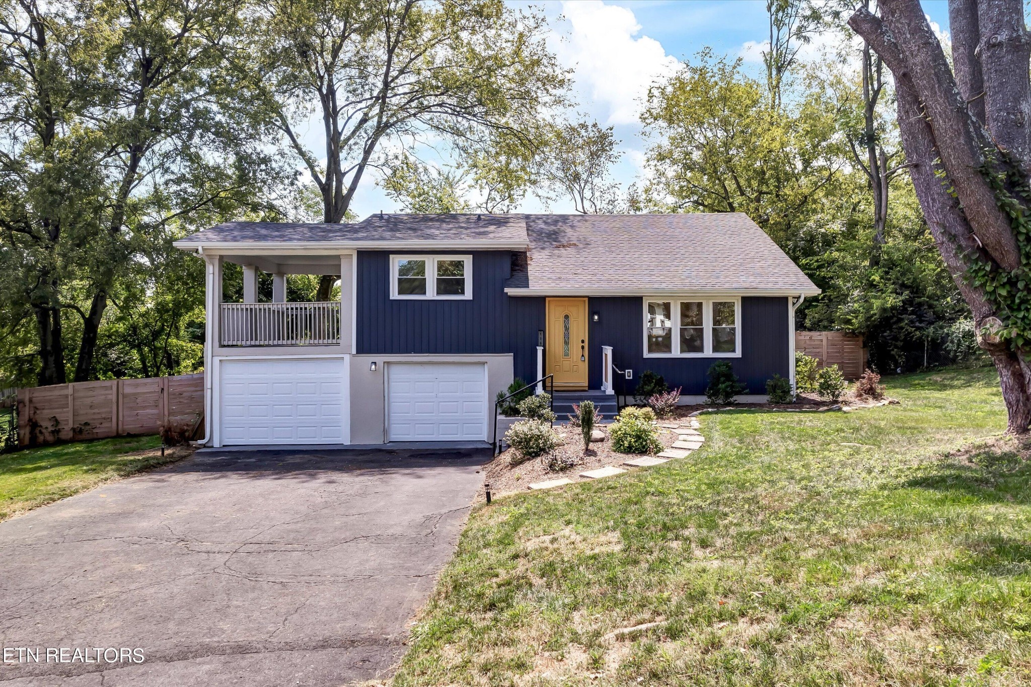 133 Londonderry Road Knoxville, TN 37923 - Photo 1 of 35 a front view of a house with a yard and trees