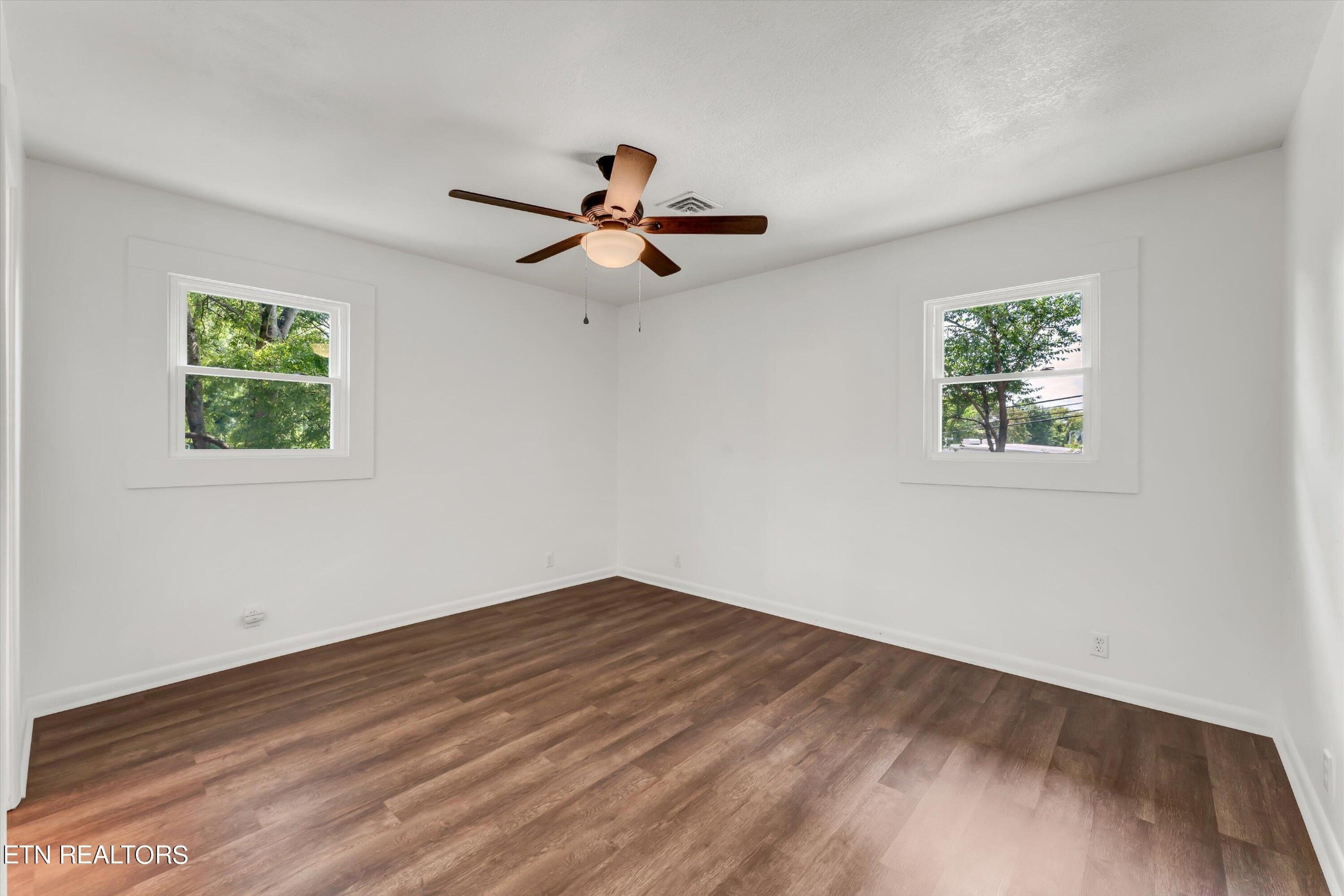 133 Londonderry Road Knoxville, TN 37923 - Photo 15 of 35 a view of room with hardwood floor and a ceiling fan