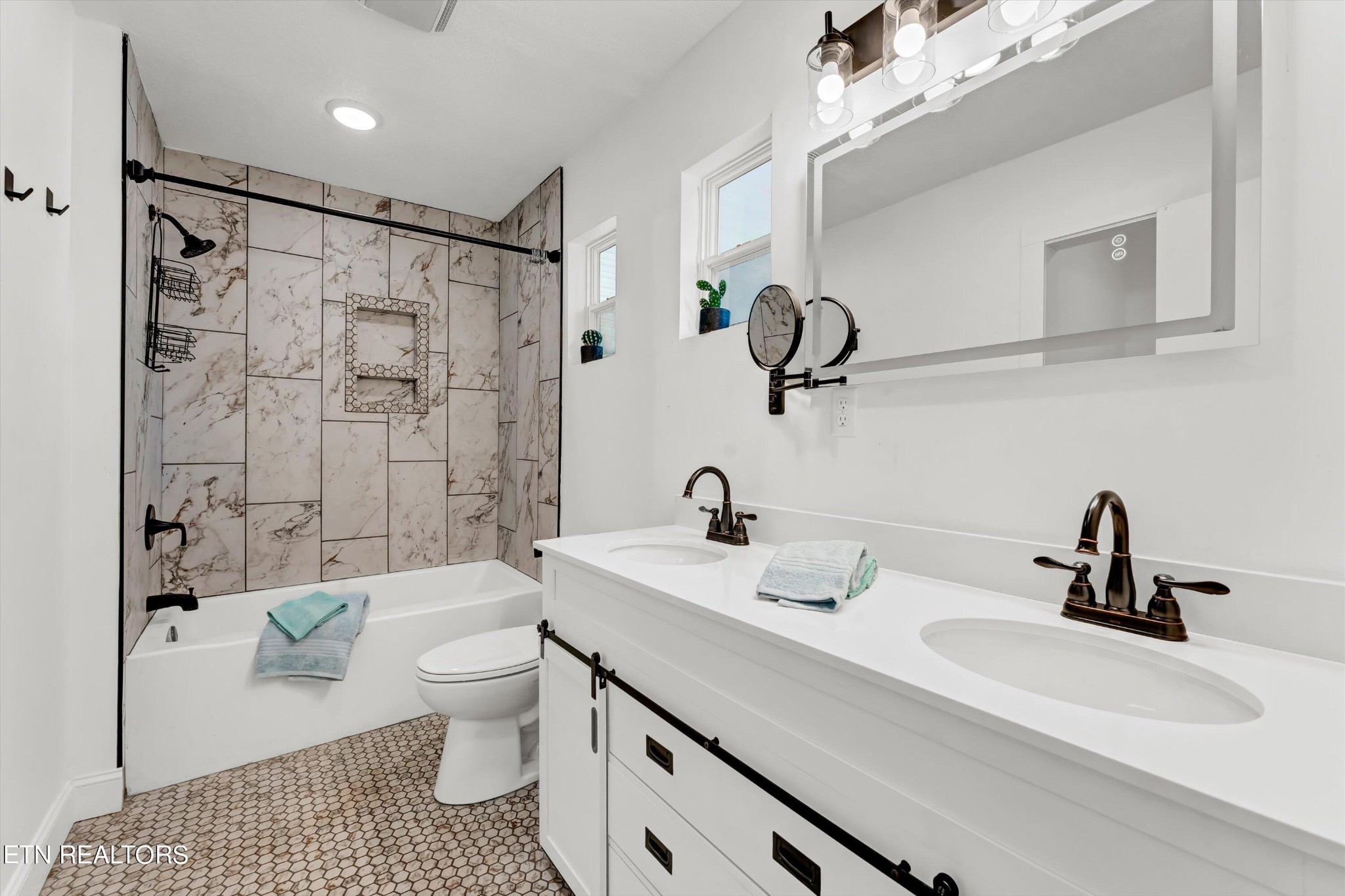 133 Londonderry Road Knoxville, TN 37923 - Photo 17 of 35 a bathroom with a sink a toilet and shower