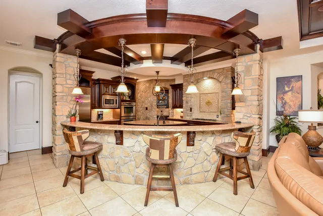 a kitchen with a table and chairs in it