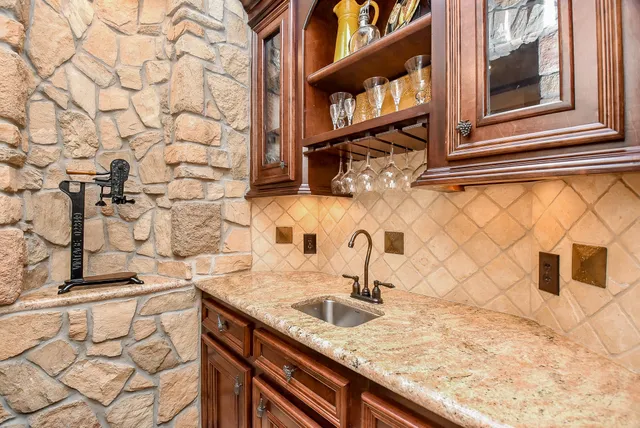 a kitchen with a sink and cabinets
