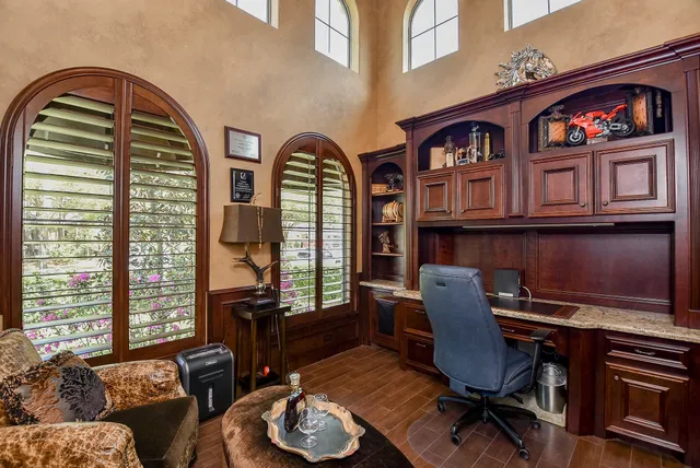 a view of a livingroom with furniture and a window