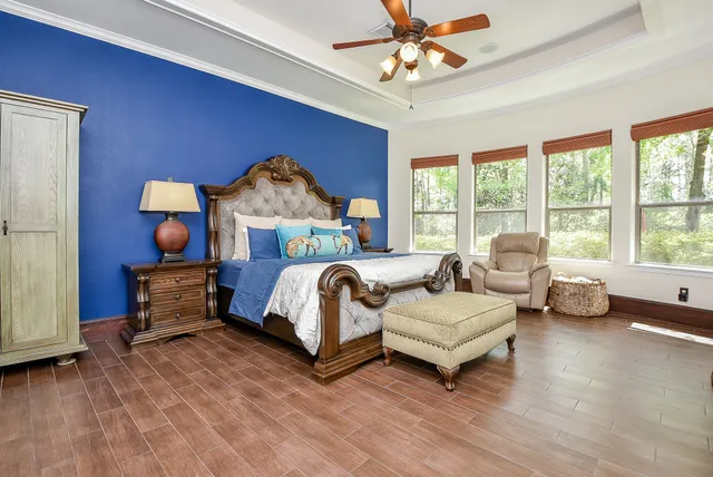 a bedroom with a bed and a couch