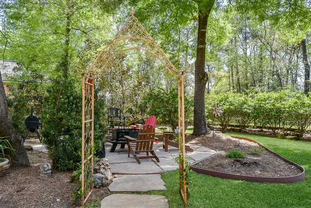 a view of a backyard with sitting area