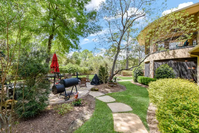 a view of a house with backyard porch and sitting area