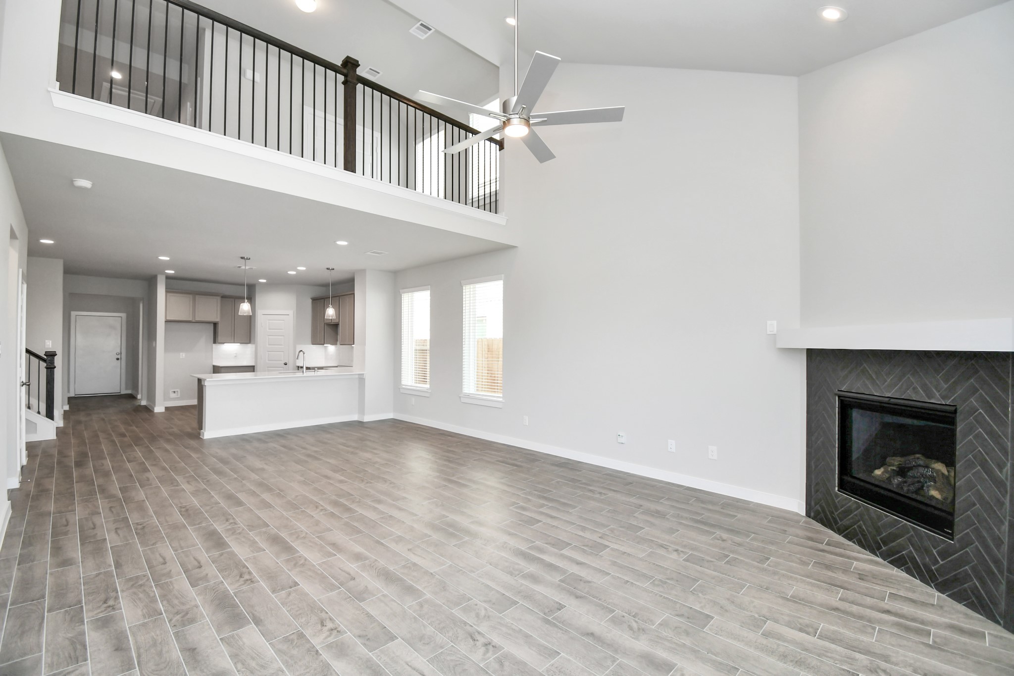 14823 Surfbird Lane Houston, TX 77049 - Photo 17 of 45 Gather the family and guests together in your lovely living room! Featuring soaring high ceilings, recessed lighting, ceiling fan, custom paint, gorgeous floors, and large windows that provide plenty of natural lighting throughout the day.