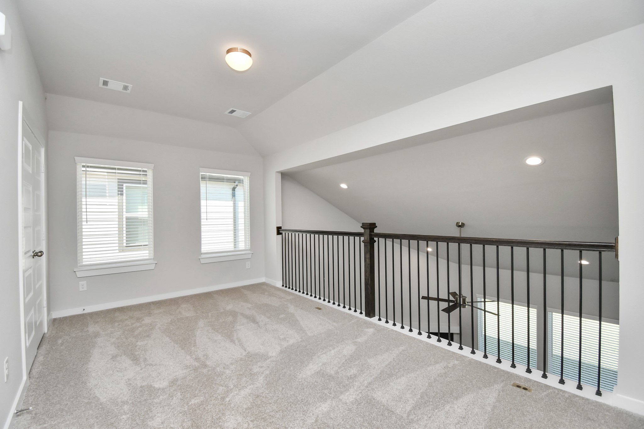 14823 Surfbird Lane Houston, TX 77049 - Photo 27 of 45 Come upstairs and enjoy a day of leisure in this fabulous game room! This is the perfect hangout spot or adult game room! Features plush carpet, high ceilings, custom paint and windows for plenty of natural light.