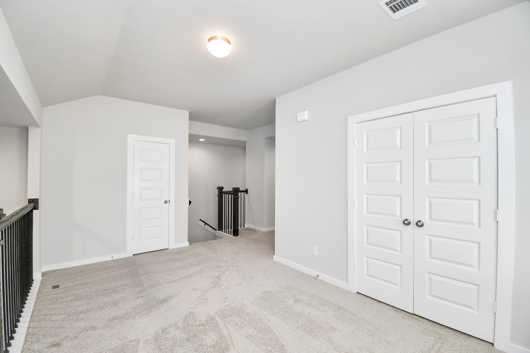 14823 Surfbird Lane Houston, TX 77049 - Photo 29 of 45 Discover a haven of leisure in this fantastic game room! Whether you're seeking a casual hangout or an adult gaming retreat, this space has it all. Enjoy the luxurious feel of plush carpet underfoot, the expansive ambiance of high ceilings, custom paint that adds a touch of personality, and windows that flood the room with refreshing natural light.