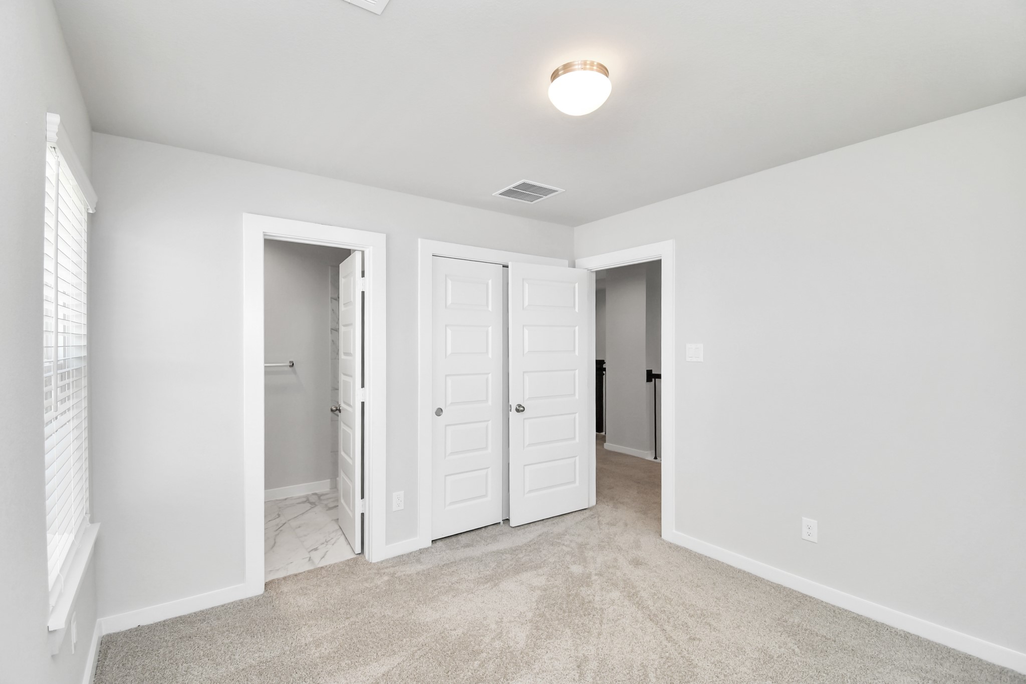 14823 Surfbird Lane Houston, TX 77049 - Photo 30 of 45 Generously sized secondary bedrooms featuring spacious closets, soft and inviting carpeting underfoot, large windows allowing plenty of natural light, and the added touch of privacy blinds for your personal retreat.