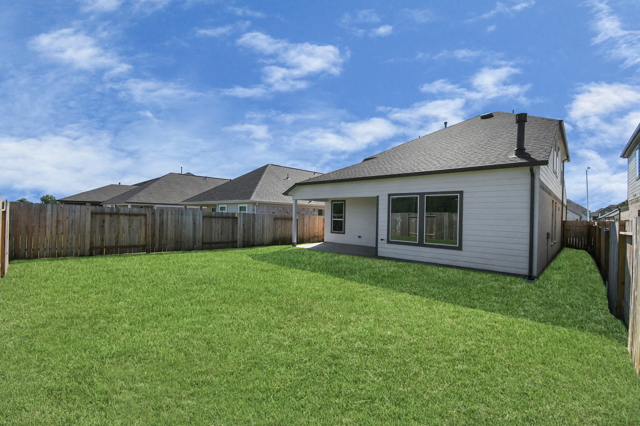 14823 Surfbird Lane Houston, TX 77049 - Photo 40 of 45 Backyard retreat, offering an abundance of space for kids to play and explore. The possibilities are endless in this outdoor haven, where the joy of open-air activities and family gatherings awaits.