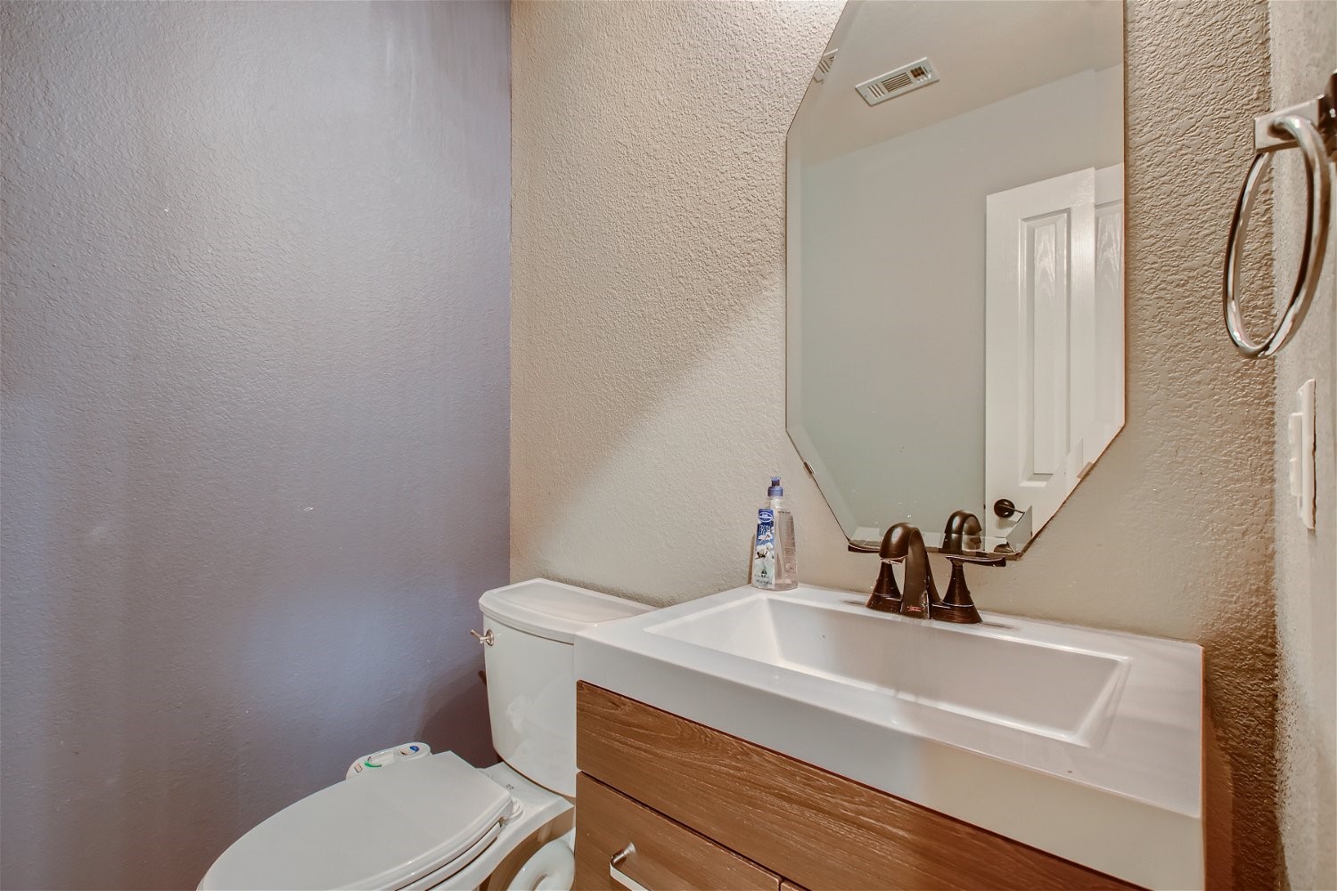 5320 Spirea Cove Austin, TX 78749 - Photo 13 of 28 a bathroom with a sink a toilet and a mirror