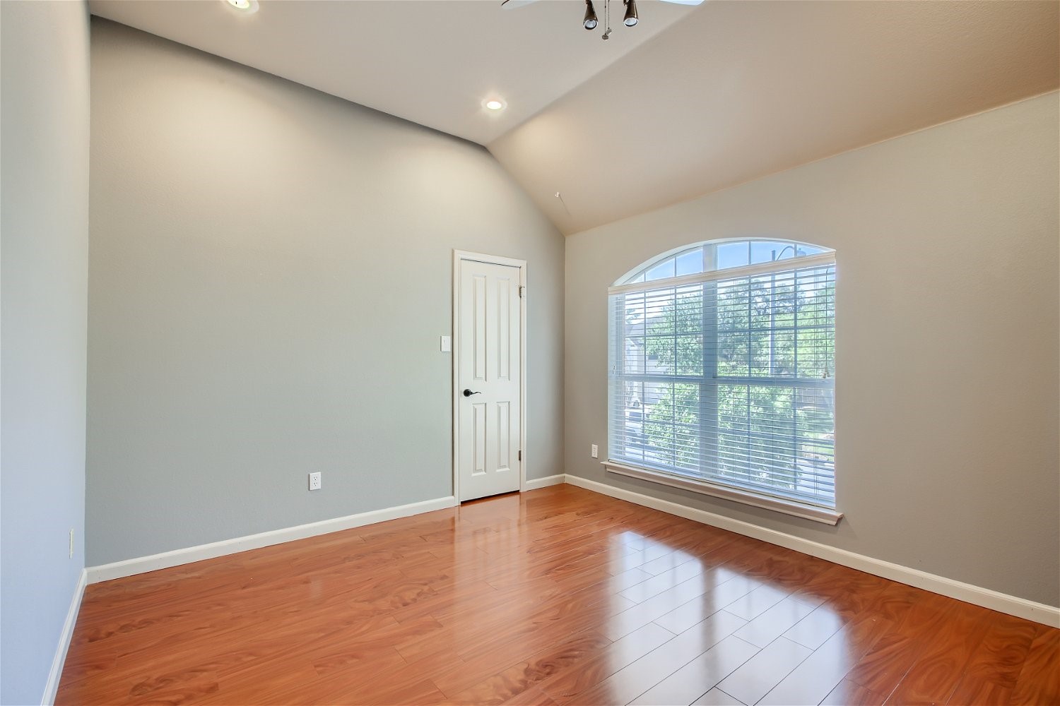 5320 Spirea Cove Austin, TX 78749 - Photo 19 of 28 an empty room with wooden floor and windows
