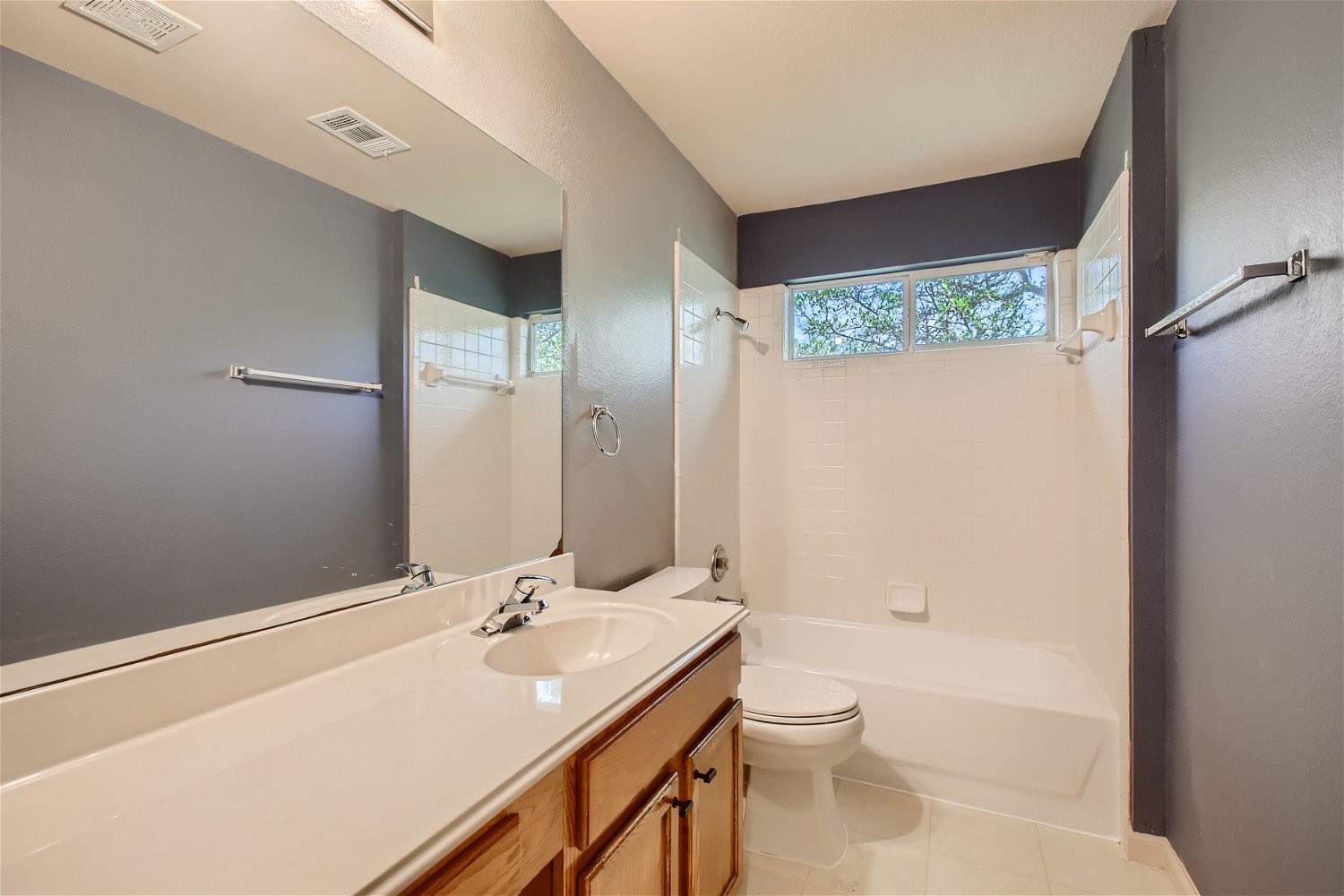 5320 Spirea Cove Austin, TX 78749 - Photo 21 of 28 a bathroom with a granite countertop sink toilet and shower