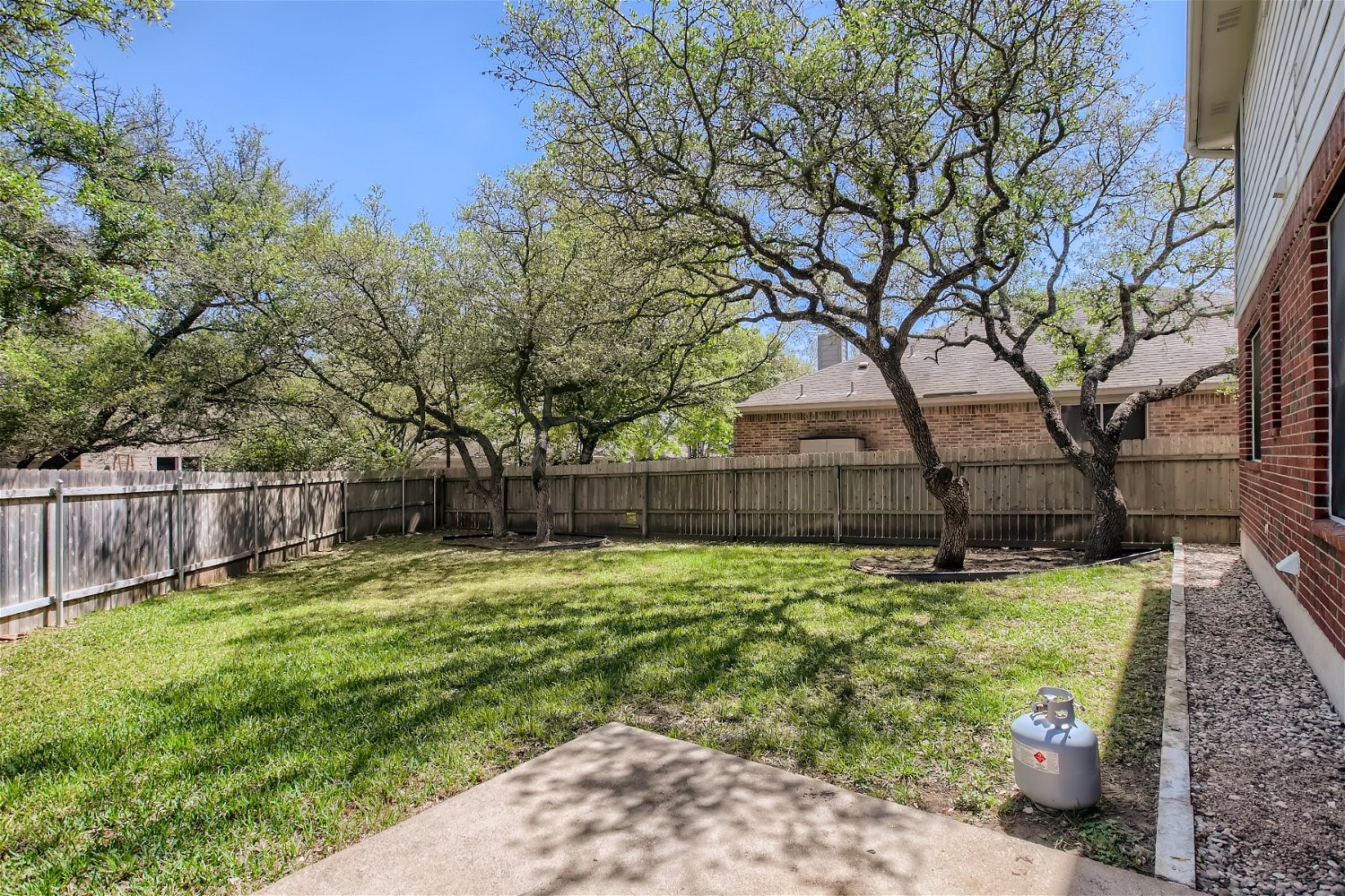 5320 Spirea Cove Austin, TX 78749 - Photo 26 of 28 a backyard of a house with lots of green space