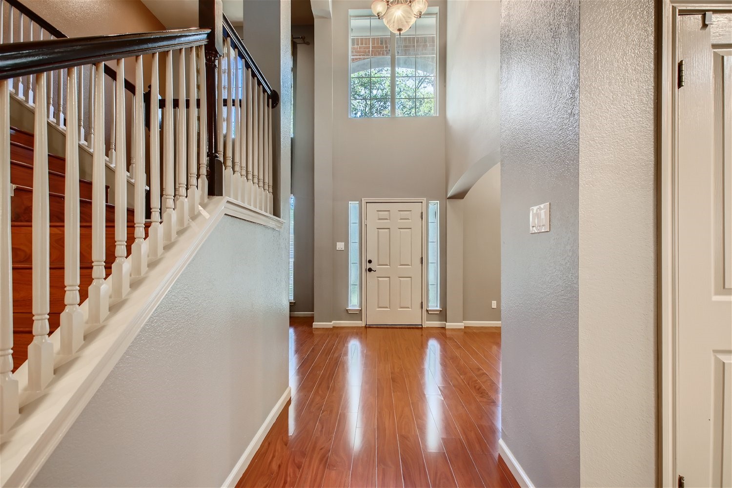 5320 Spirea Cove Austin, TX 78749 - Photo 4 of 28 a view of a hallway with wooden floor and staircase