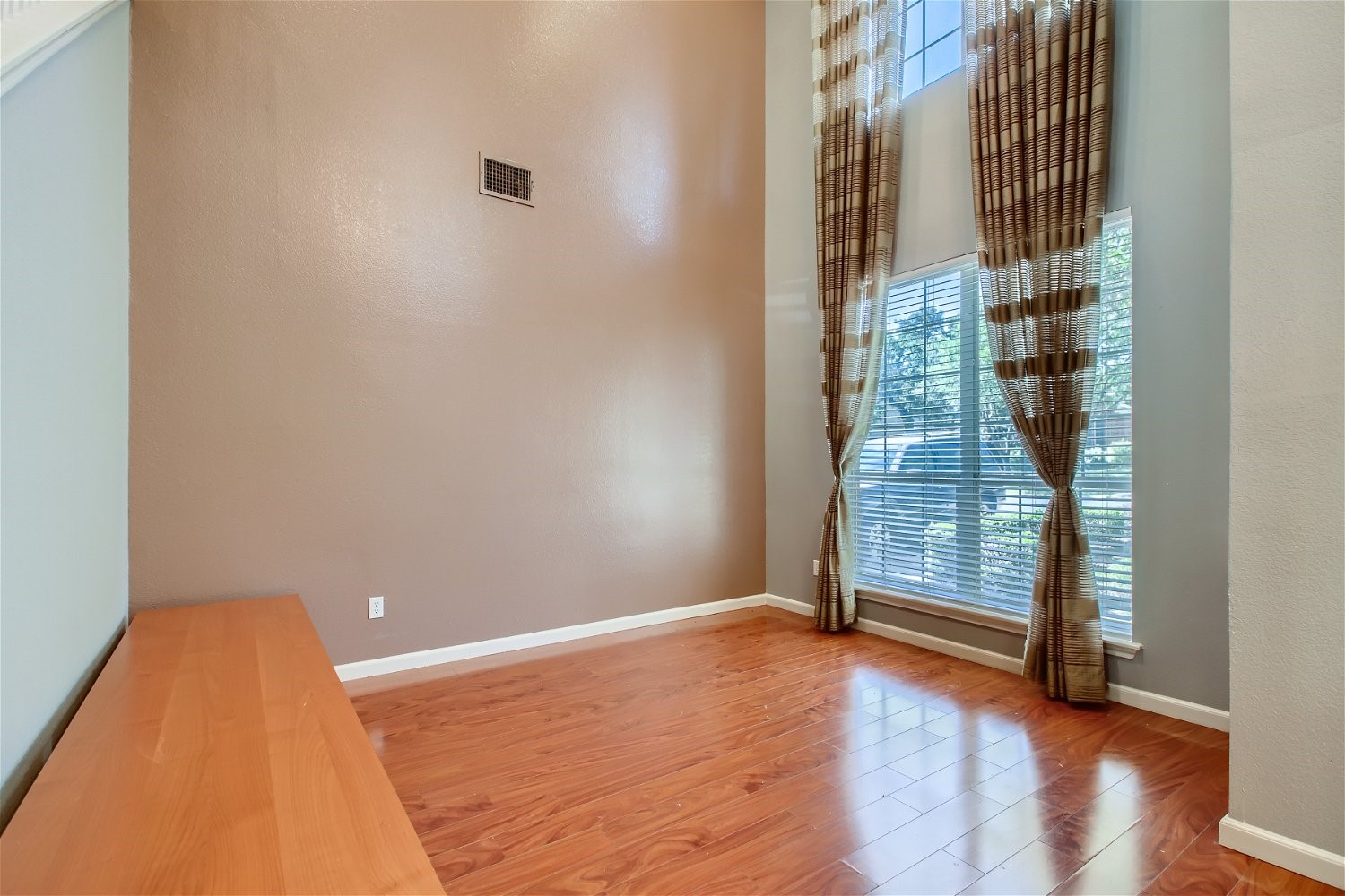5320 Spirea Cove Austin, TX 78749 - Photo 5 of 28 an empty room with wooden floor and windows
