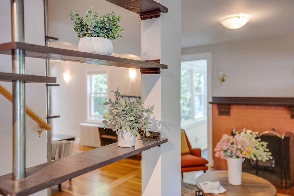 62 Gleason Road Lexington, MA 02420 - Photo 11 of 39 a view of a dining room with furniture and a potted plant