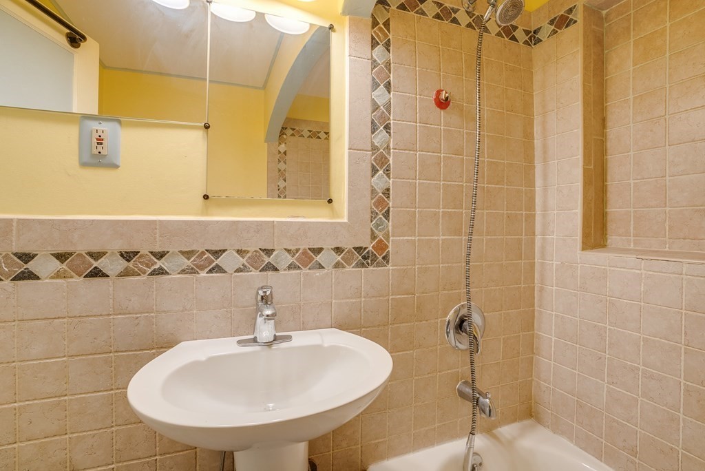 62 Gleason Road Lexington, MA 02420 - Photo 18 of 39 a bathroom with a sink a toilet and shower