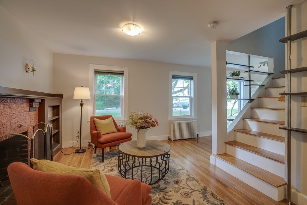 62 Gleason Road Lexington, MA 02420 - Photo 19 of 39 a living room with furniture and a floor to ceiling window