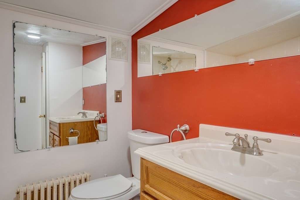 62 Gleason Road Lexington, MA 02420 - Photo 23 of 39 a bathroom with a sink and a mirror