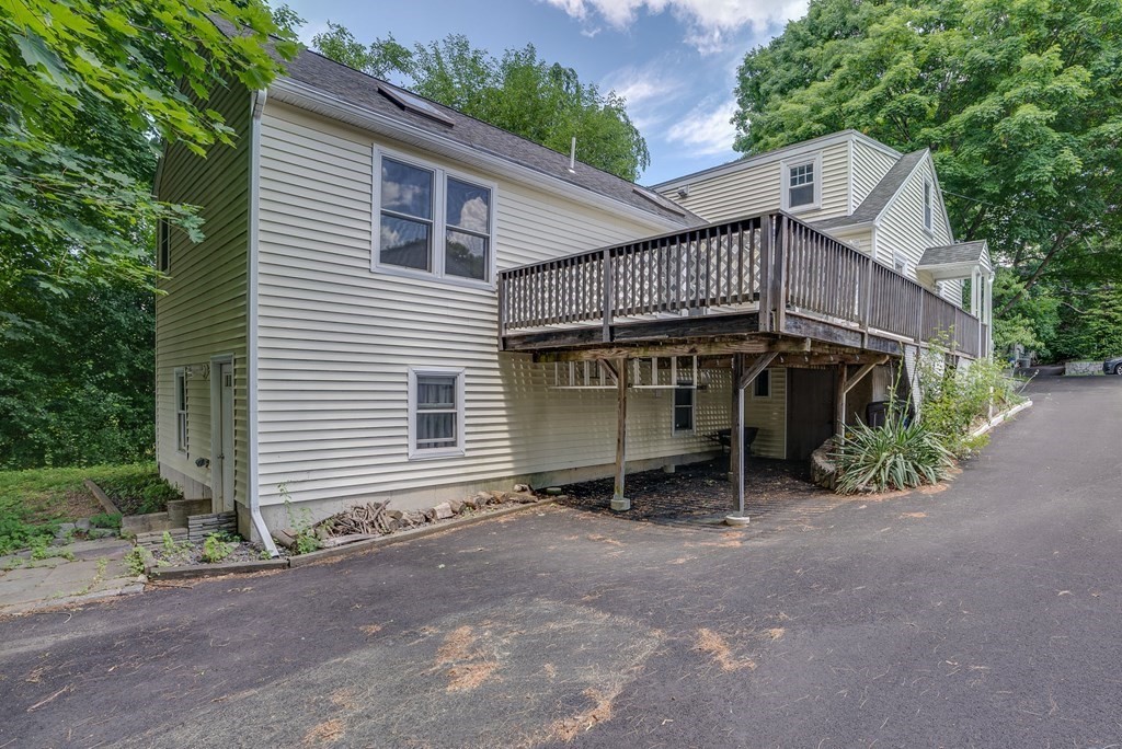 62 Gleason Road Lexington, MA 02420 - Photo 36 of 39 a view of a house with a yard and garage