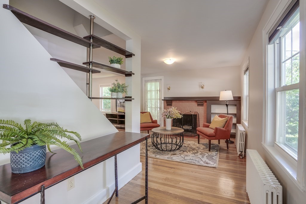 62 Gleason Road Lexington, MA 02420 - Photo 9 of 39 a living room with furniture and a fireplace