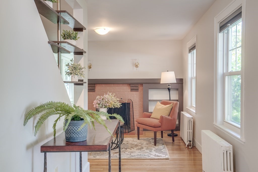 62 Gleason Road Lexington, MA 02420 - Photo 10 of 39 a living room with furniture and a potted plant