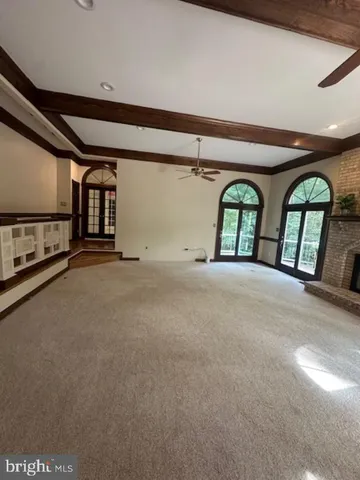 a view of an empty room with windows