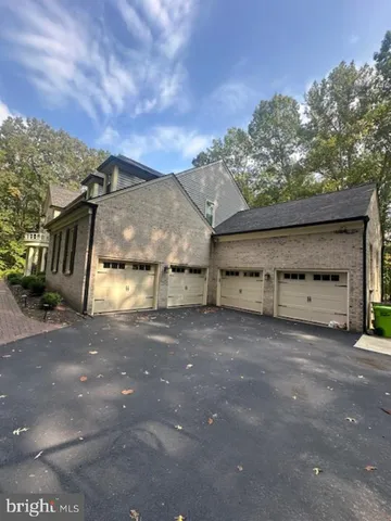 a view of a house with a yard and garage
