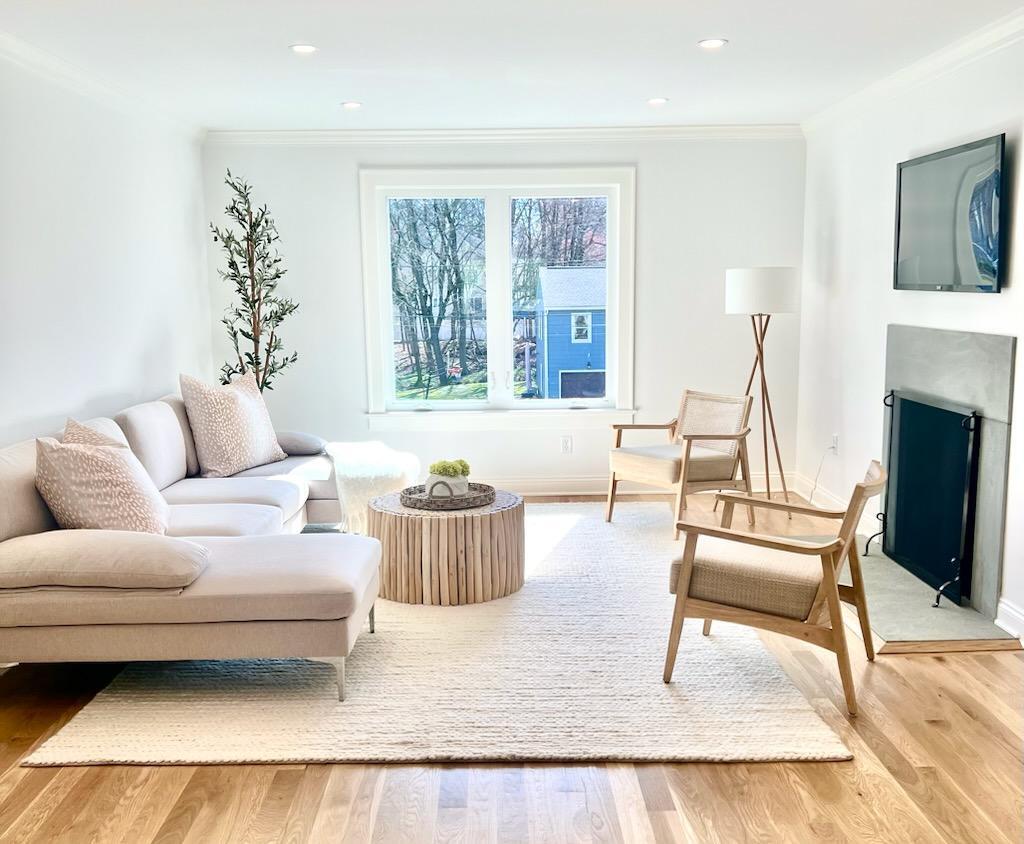 34 Crimmins Road Darien, CT 06820 - Photo 1 of 28 a living room with furniture and a fireplace
