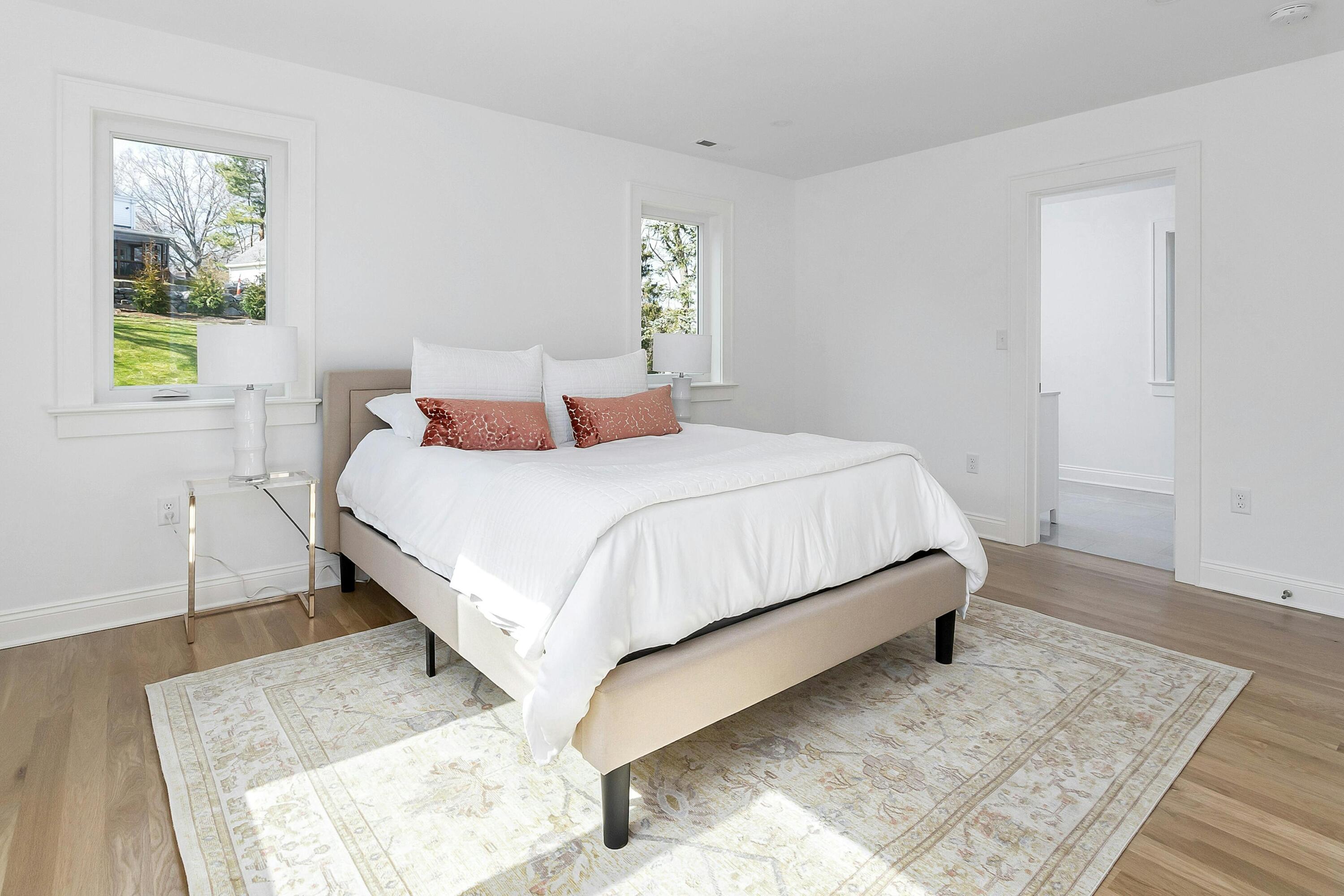 34 Crimmins Road Darien, CT 06820 - Photo 13 of 28 a bedroom with a bed lamp and a rug