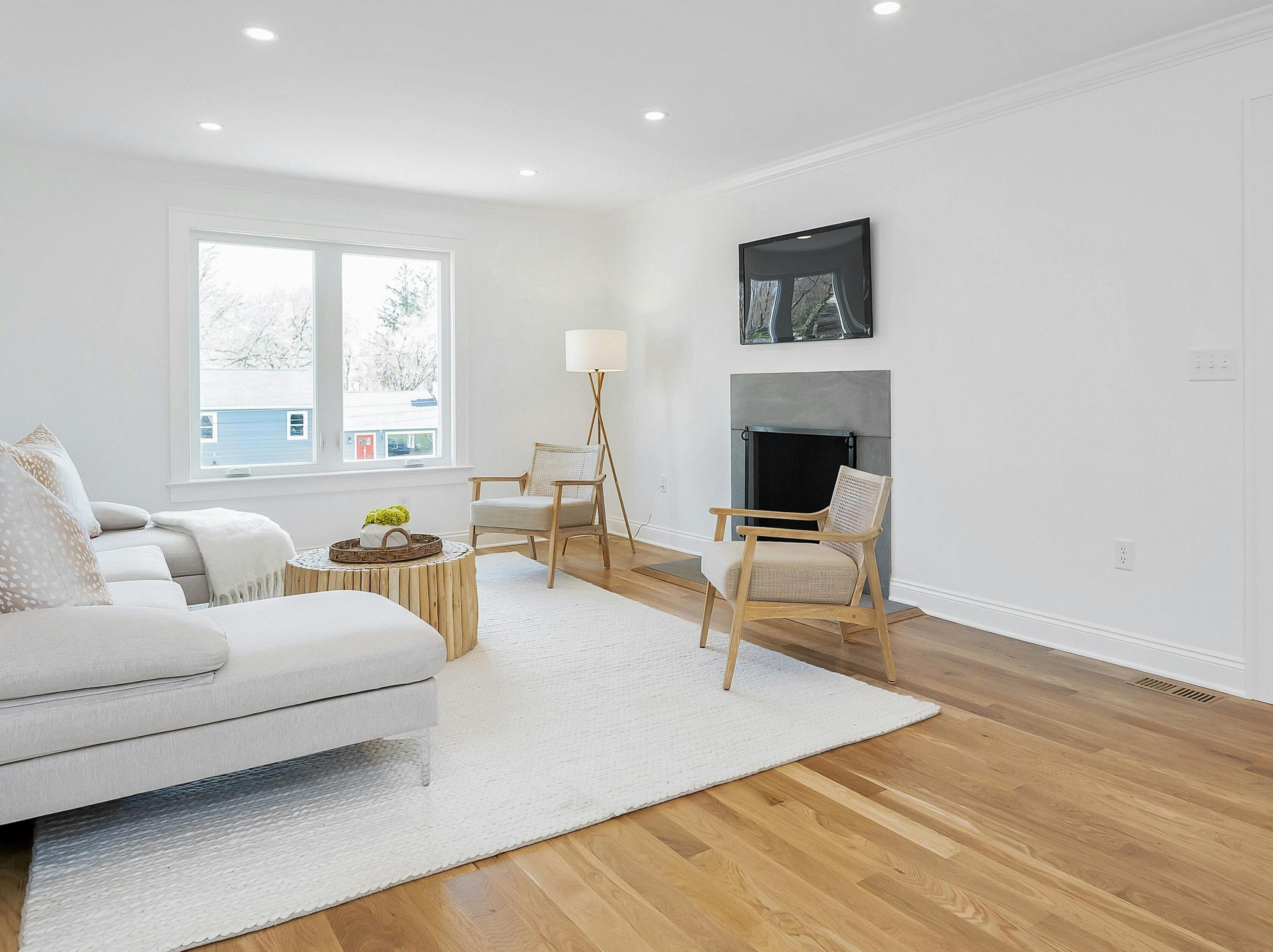 34 Crimmins Road Darien, CT 06820 - Photo 4 of 28 a living room with furniture and a fireplace