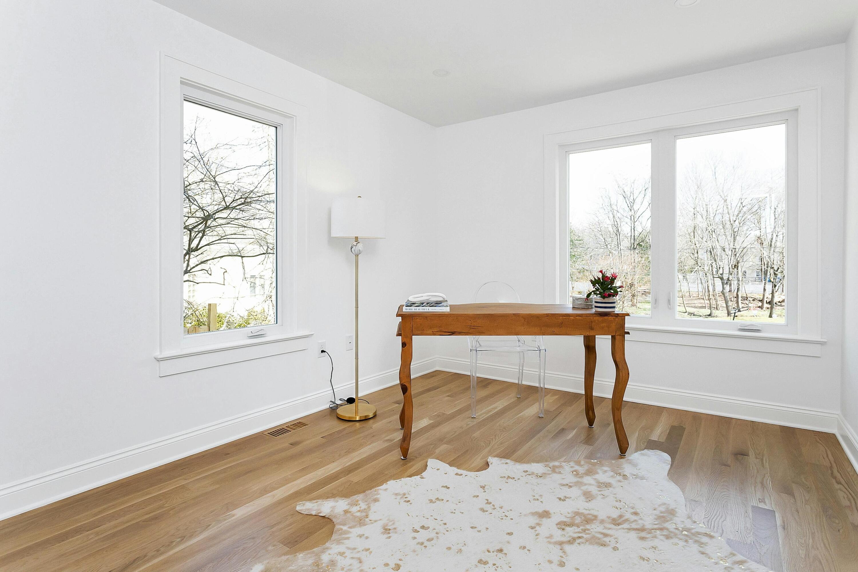 34 Crimmins Road Darien, CT 06820 - Photo 10 of 28 a view of room with window and wooden floor