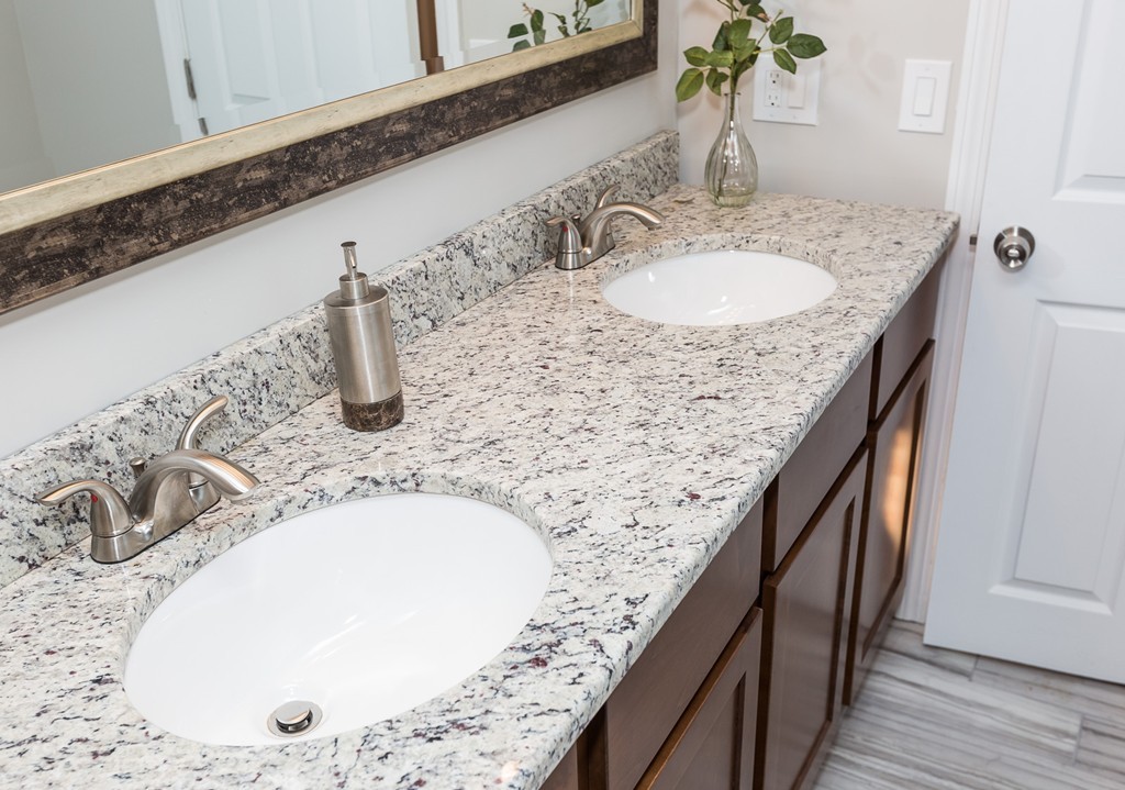 54 Oregon Street Springfield, MA 01118 - Photo 22 of 30 a bathroom with a granite countertop sink and a mirror