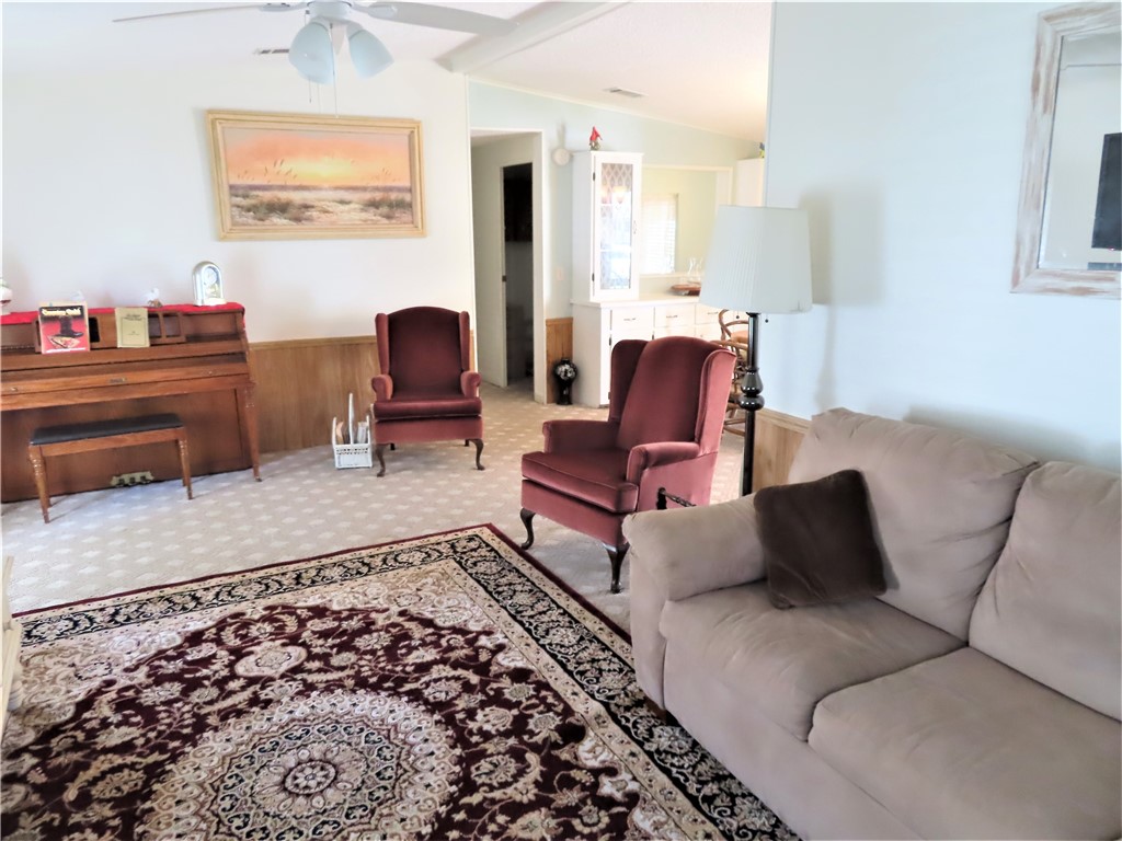 629 Marlin Circle Barefoot Bay, FL 32976 - Photo 12 of 34 a living room with furniture and a rug