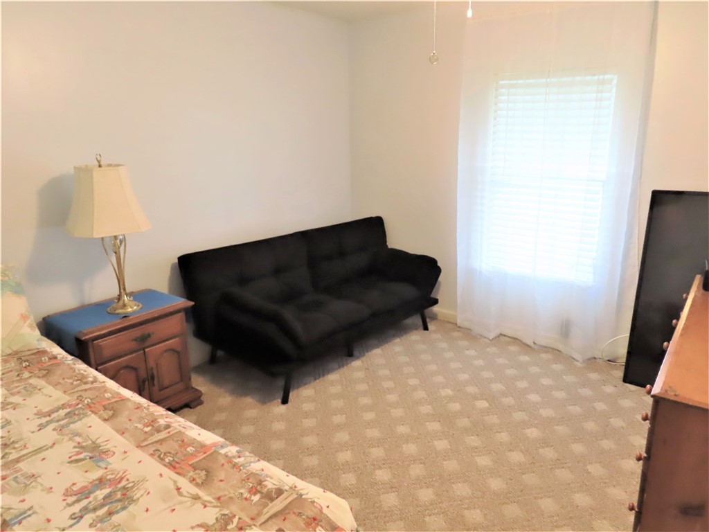 629 Marlin Circle Barefoot Bay, FL 32976 - Photo 21 of 34 a living room with a couch and a dresser