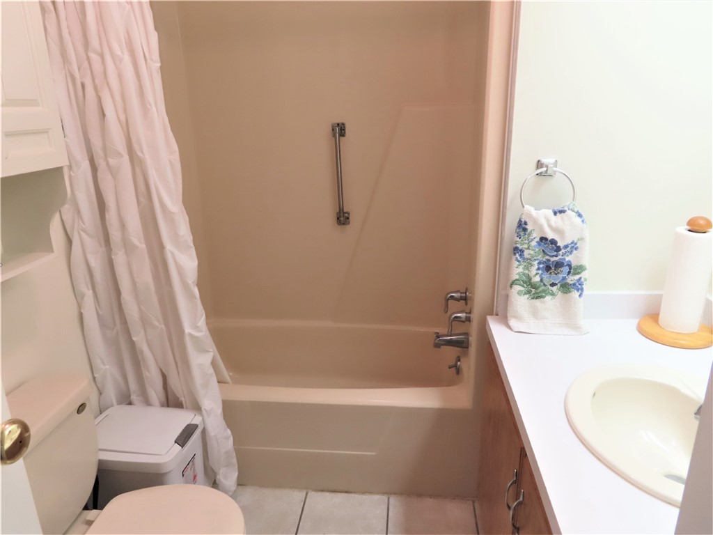 629 Marlin Circle Barefoot Bay, FL 32976 - Photo 25 of 34 a bathroom with a granite countertop sink and a mirror