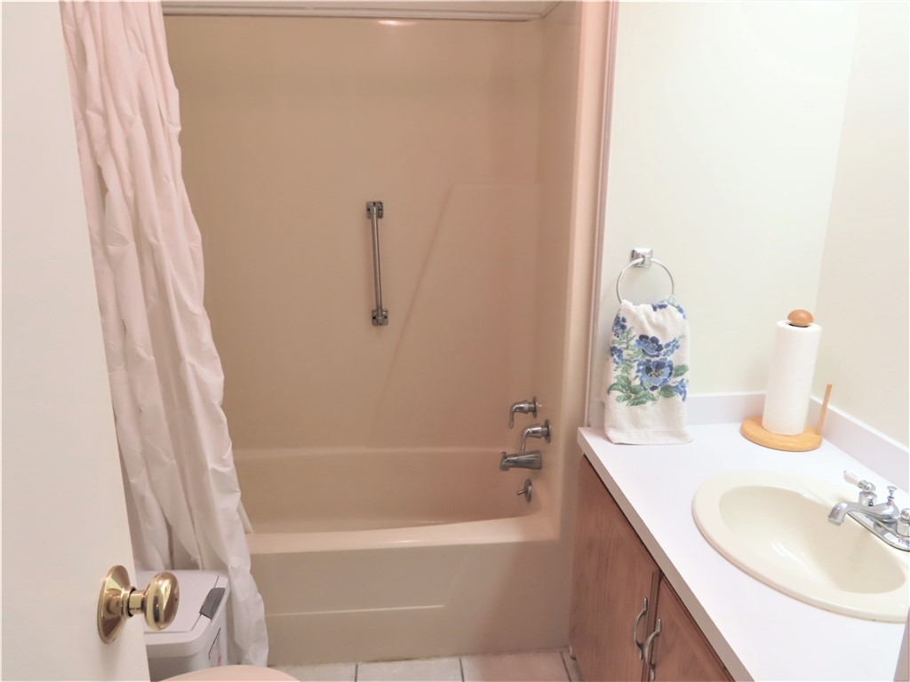 629 Marlin Circle Barefoot Bay, FL 32976 - Photo 26 of 34 a bathroom with a sink and a mirror