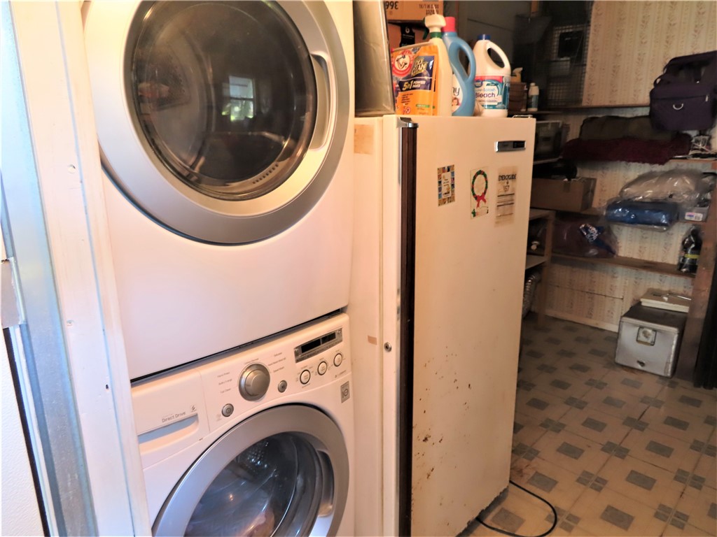 629 Marlin Circle Barefoot Bay, FL 32976 - Photo 30 of 34 a utility room with dryer and washer