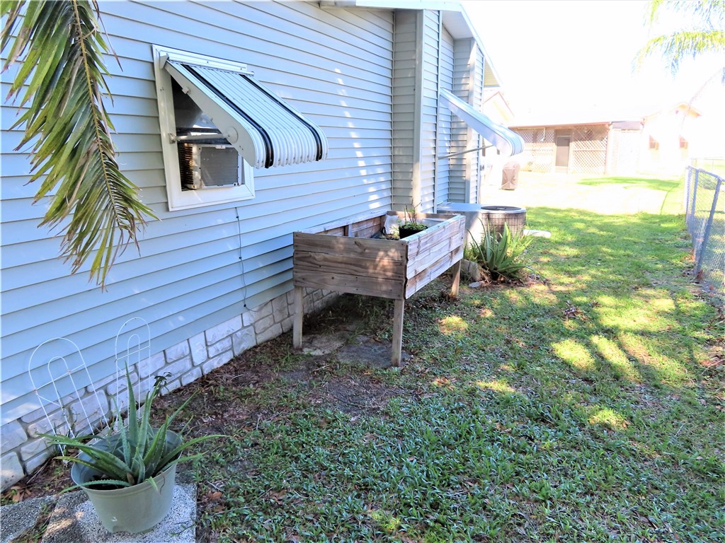 629 Marlin Circle Barefoot Bay, FL 32976 - Photo 31 of 34 a view of a house with a backyard