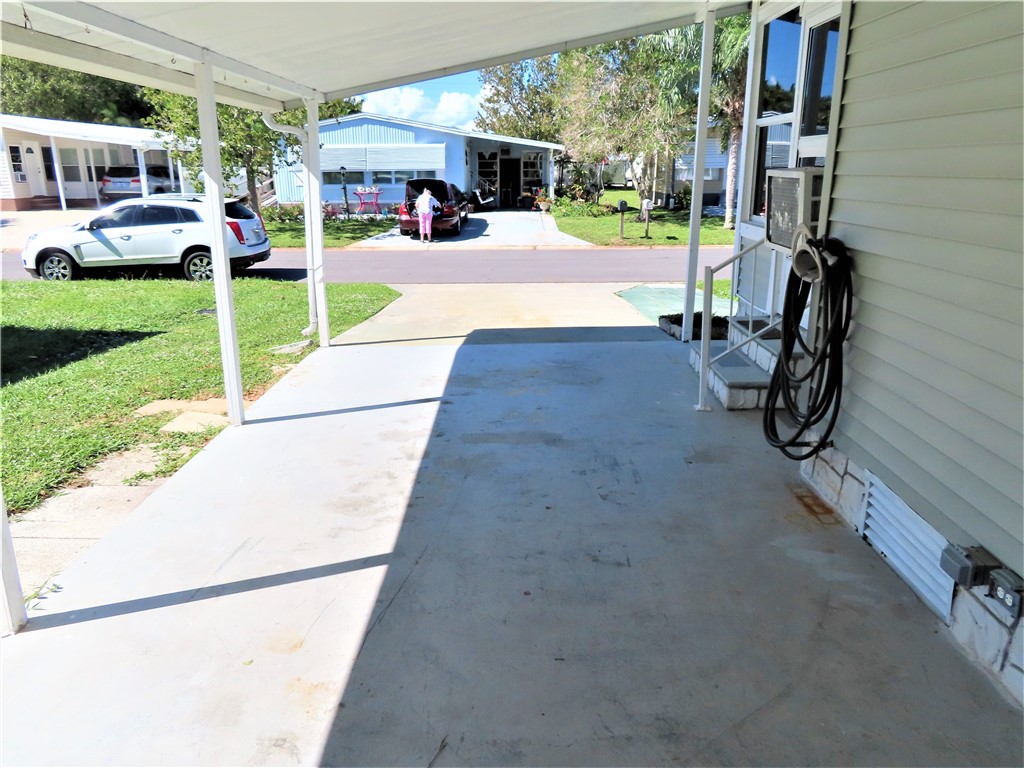 629 Marlin Circle Barefoot Bay, FL 32976 - Photo 4 of 34 a view of a park with cars parked