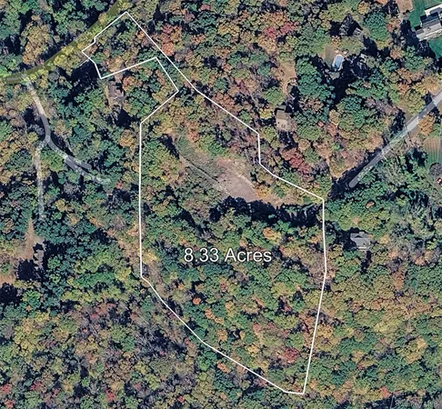 an aerial view of residential house with outdoor space