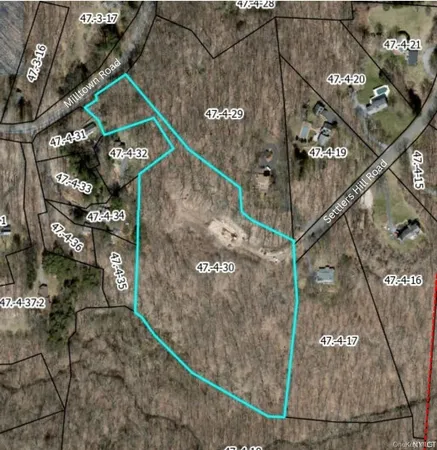 a view of swimming pool with lawn chairs and wooden fence